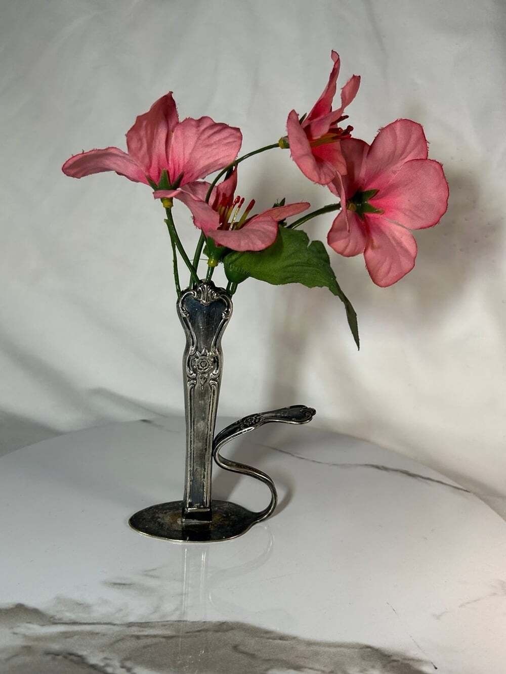 A fun bud vase made from silver plated vintage silver wear by Old Plate Company